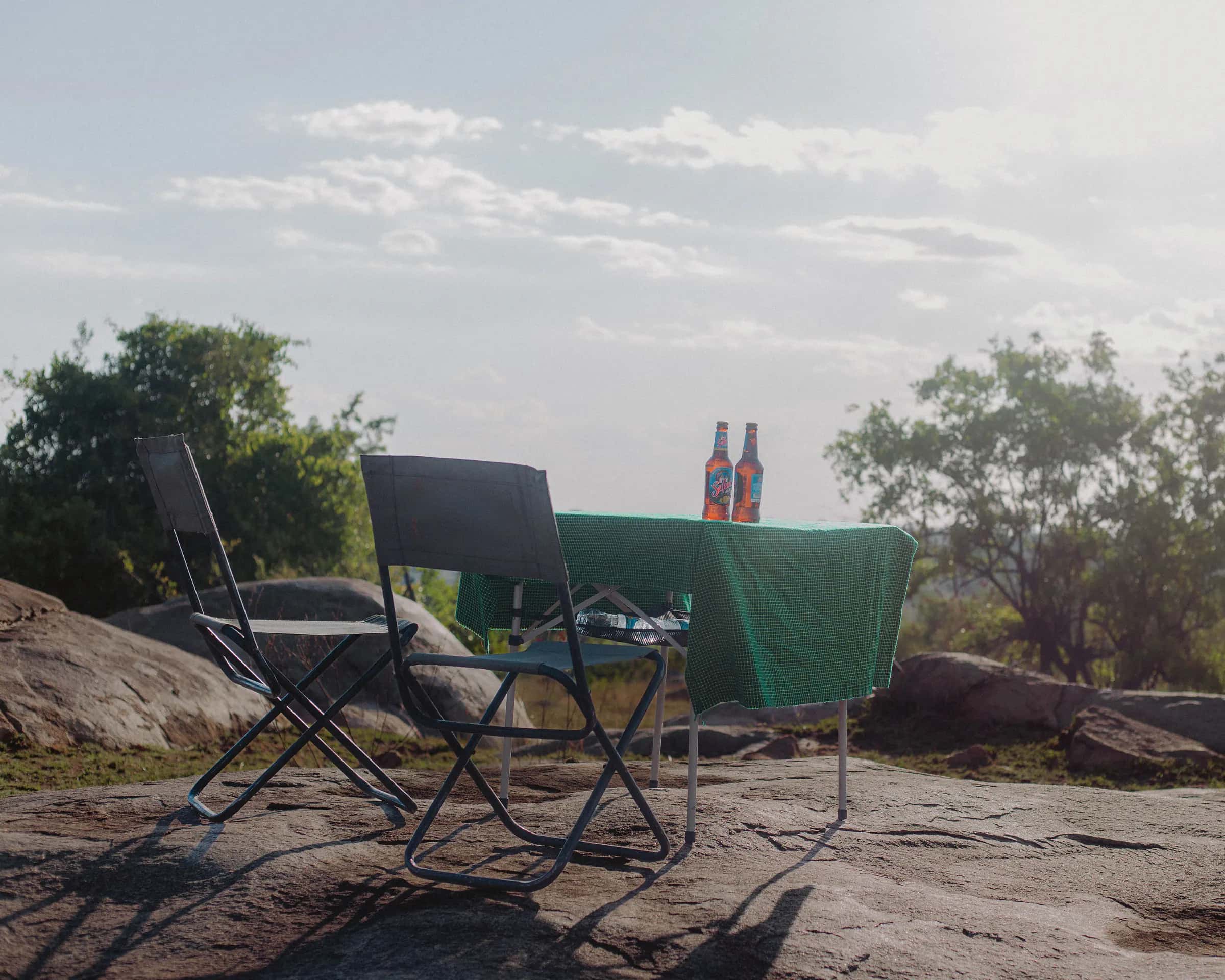 Table set for sundowners on a granite rock